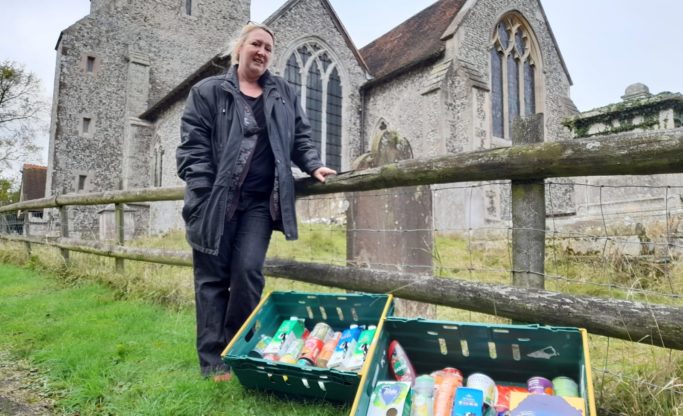 Gaynor Moss with the boxes of food donated by St Michaels and All Angels Church Throwley.
